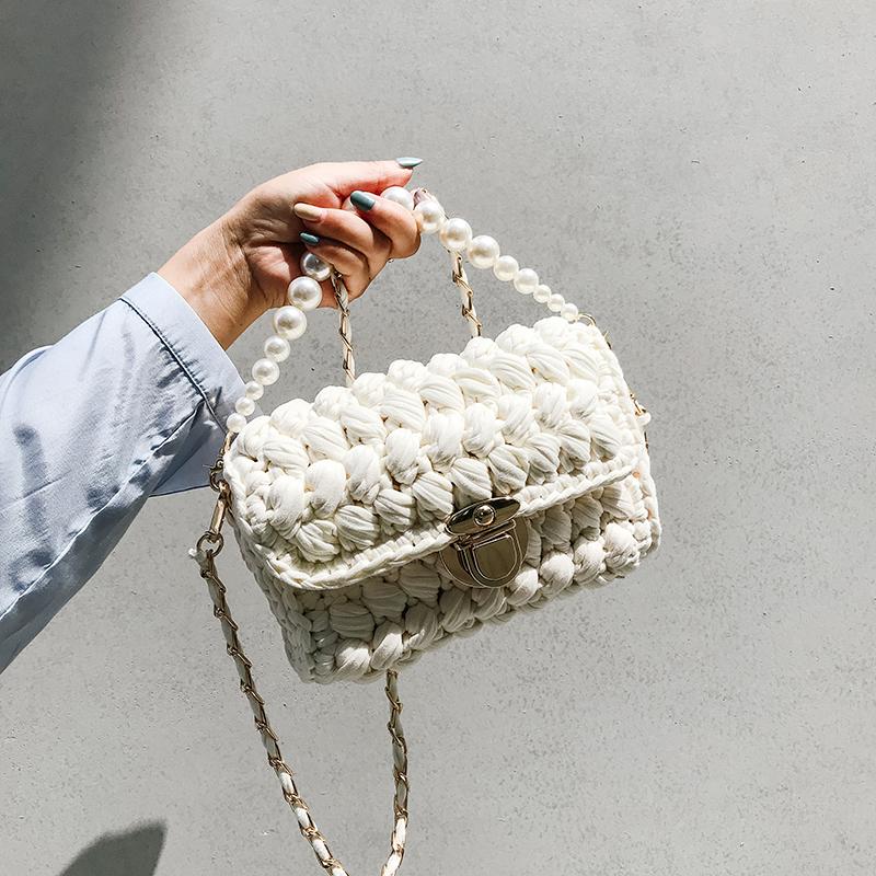 Small cheap white handbag